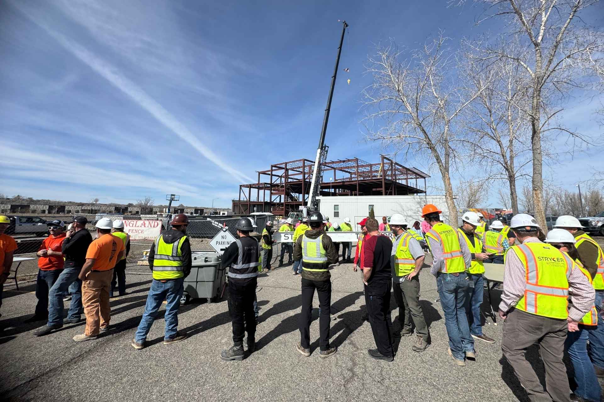 Stryker employees touring a job site under construction