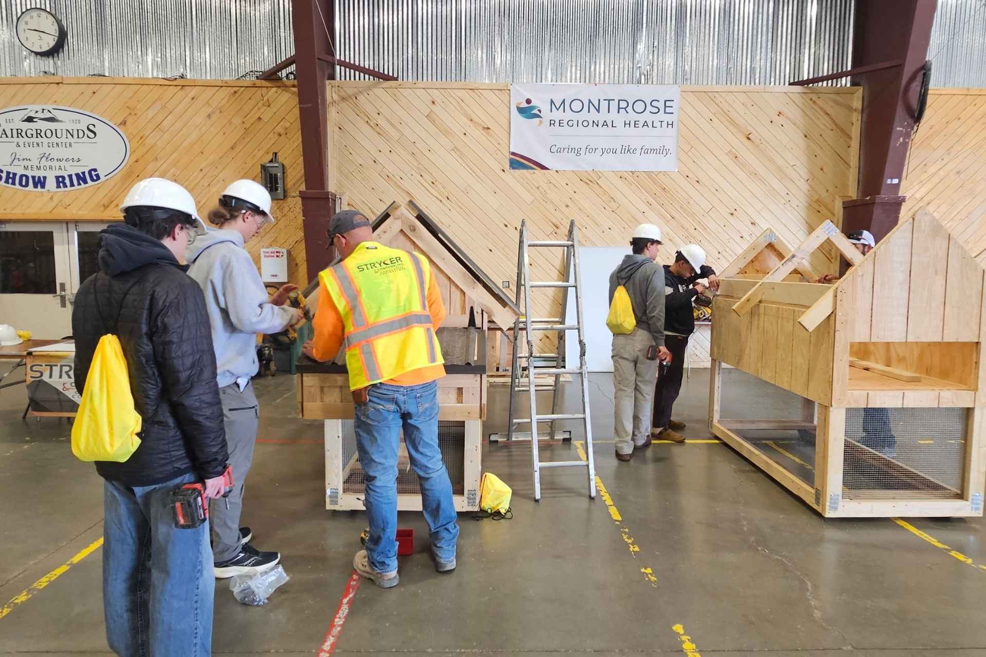 Stryker employees at a career fair demonstrating building techniques